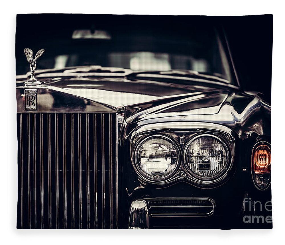Car Fleece Blanket featuring the photograph Rolls-Royce - classic British car on black background, close-up. by Michal Bednarek