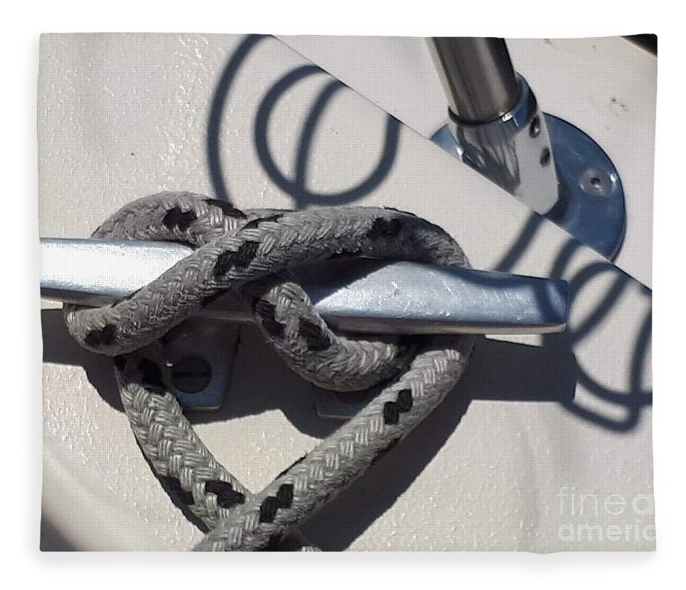 Sailing Fleece Blanket featuring the photograph Rope on cleat with wire drink holder shadows by Lisa Koyle