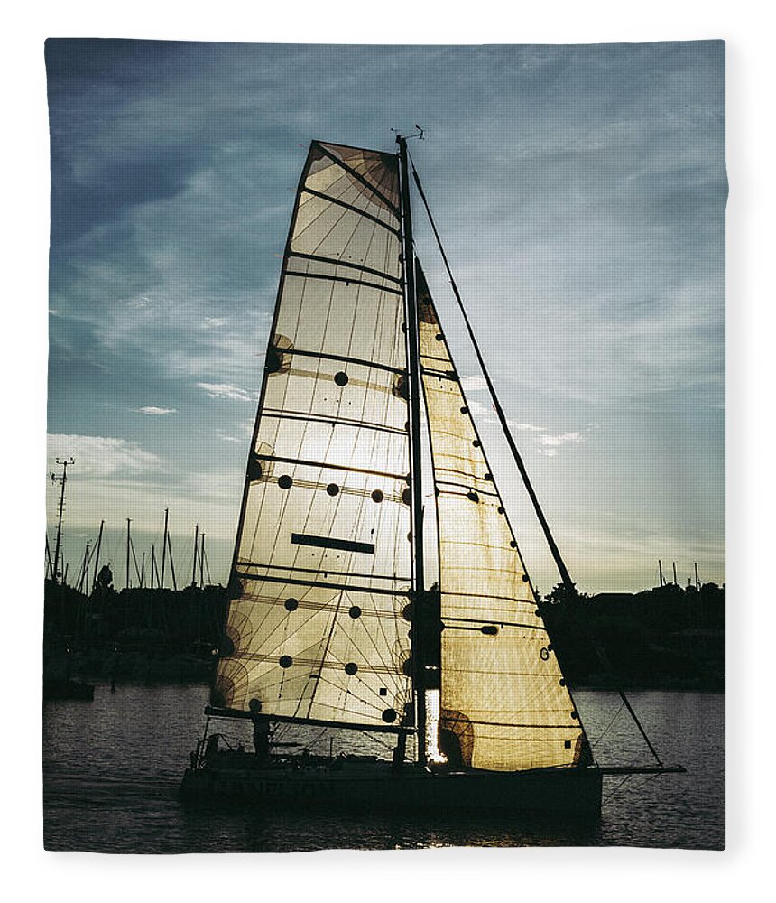 Active Fleece Blanket featuring the photograph Sailboat in Front of Sun in Harbor by Andreas Berthold