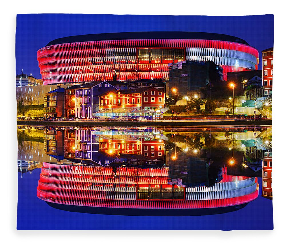 San Fleece Blanket featuring the photograph San Mames Stadium At Night With Water Reflections by Mikel Martinez de Osaba