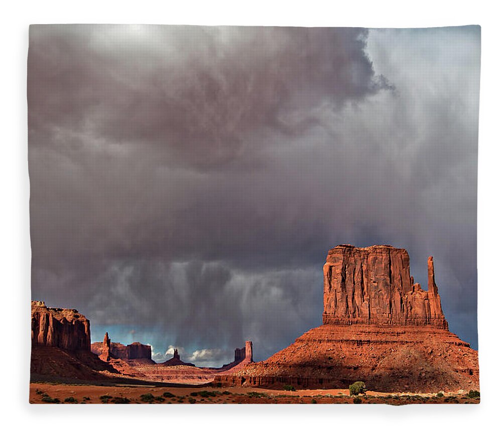 Desert Fleece Blanket featuring the photograph Storm over Monument Valley by Wesley Aston
