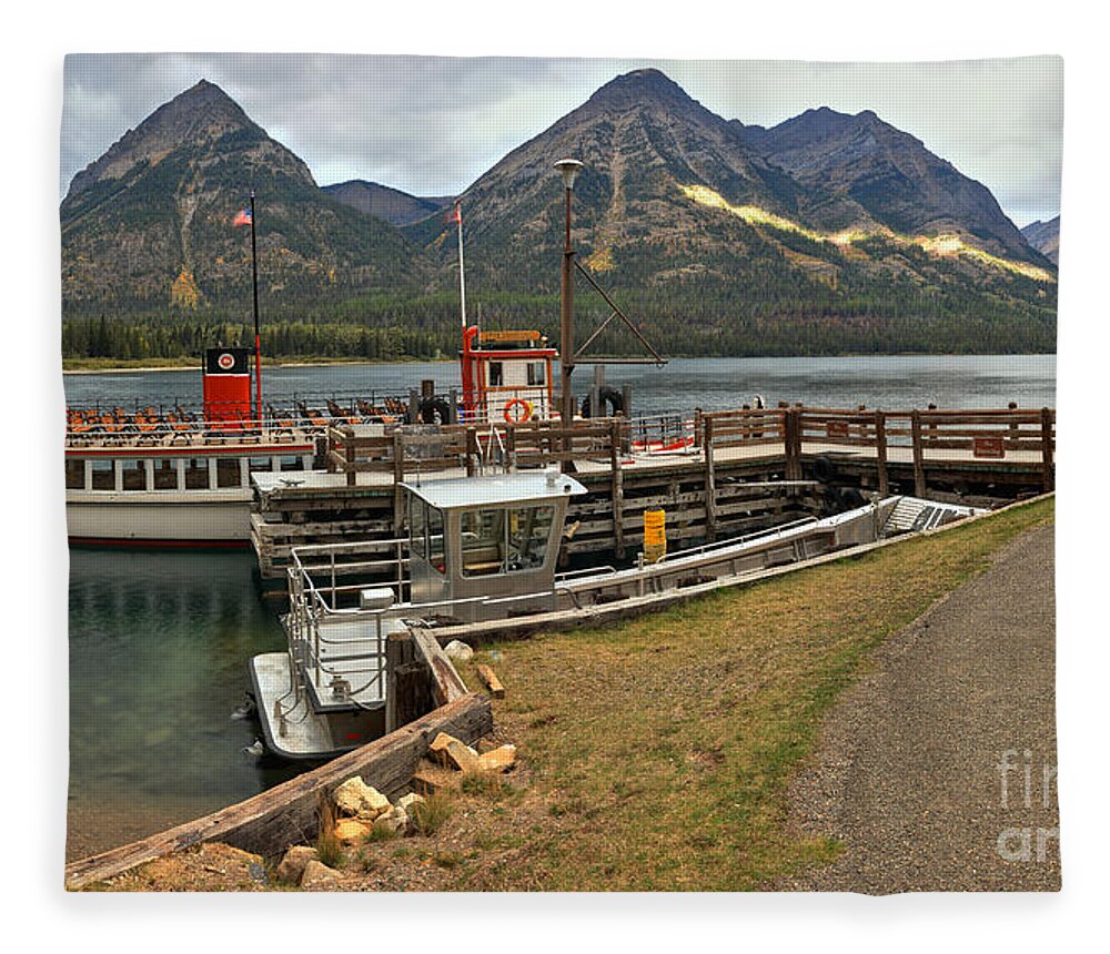 Waterton Lakes Fleece Blanket featuring the photograph The International At Goat Haunt by Adam Jewell