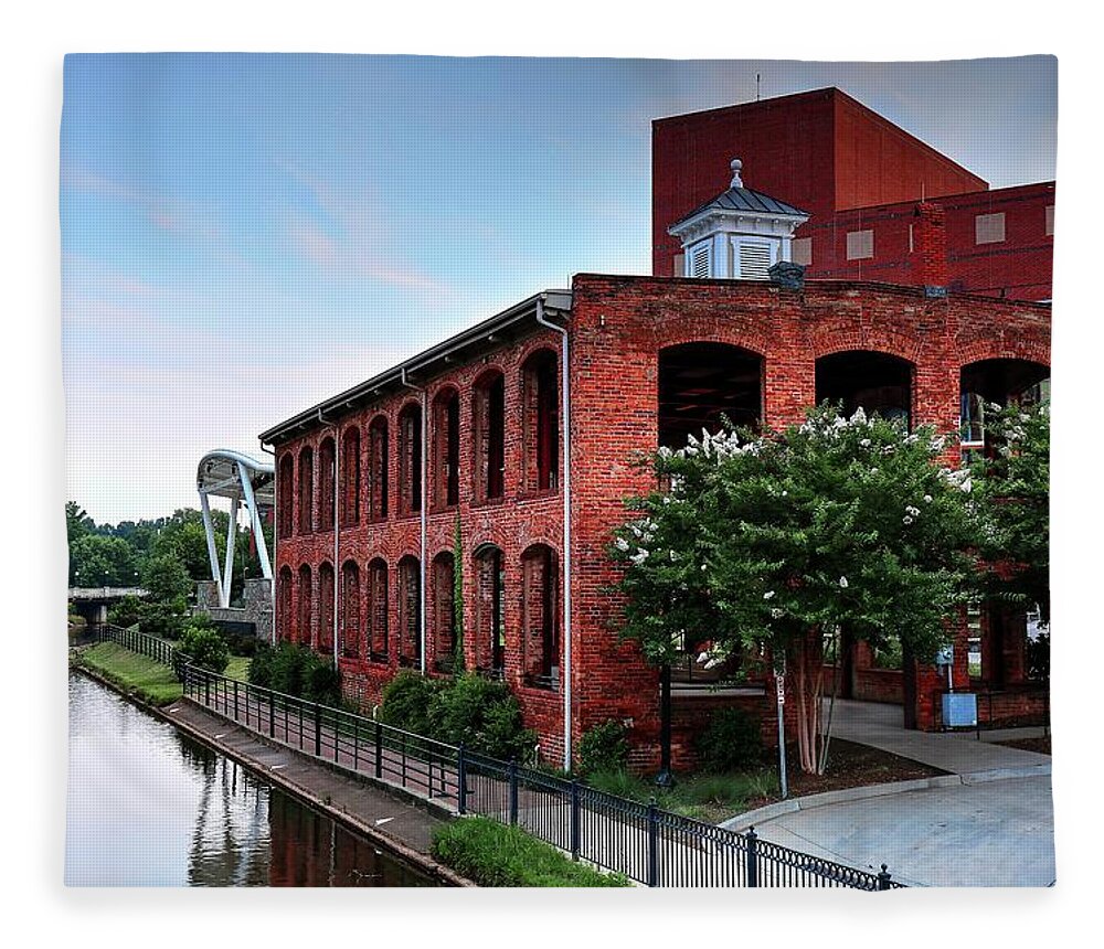 Old Mill Reedy River In Greenville Fleece Blanket featuring the photograph The Old Mill In Falls Park On The Reedy River in Greenville, South Carolina by Carol Montoya