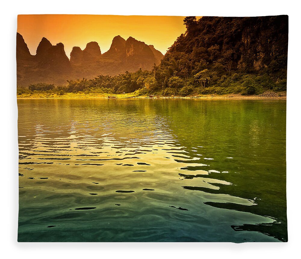 Sunset Fleece Blanket featuring the photograph The sun goes down on the mountain-China Guilin scenery Lijiang River in Yangshuo by Artto Pan