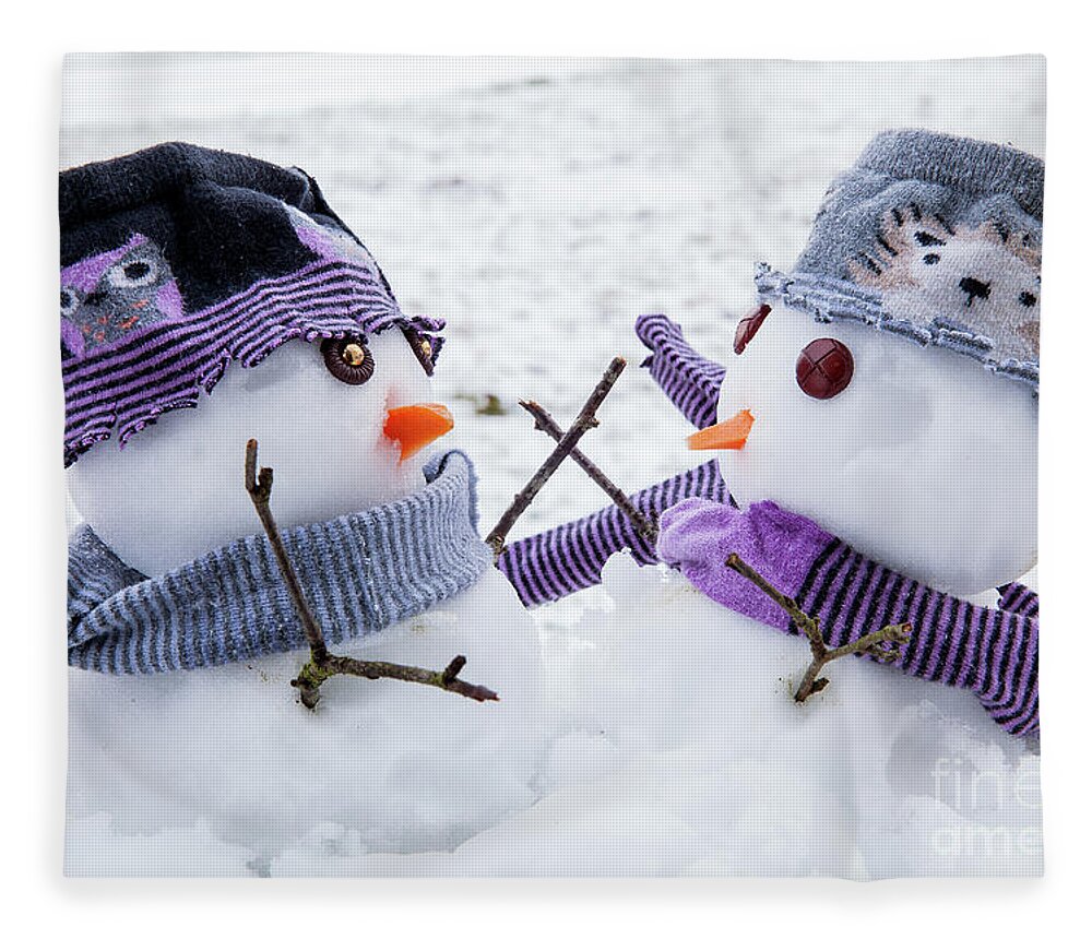 Snowmen Fleece Blanket featuring the photograph Two cute snowmen friends embracing by Simon Bratt