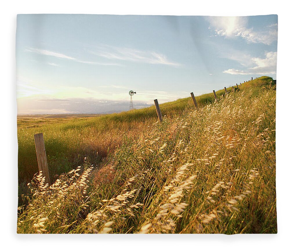 Windmill Fleece Blanket featuring the photograph Windmill and the Fence Sundown by Troy Stapek