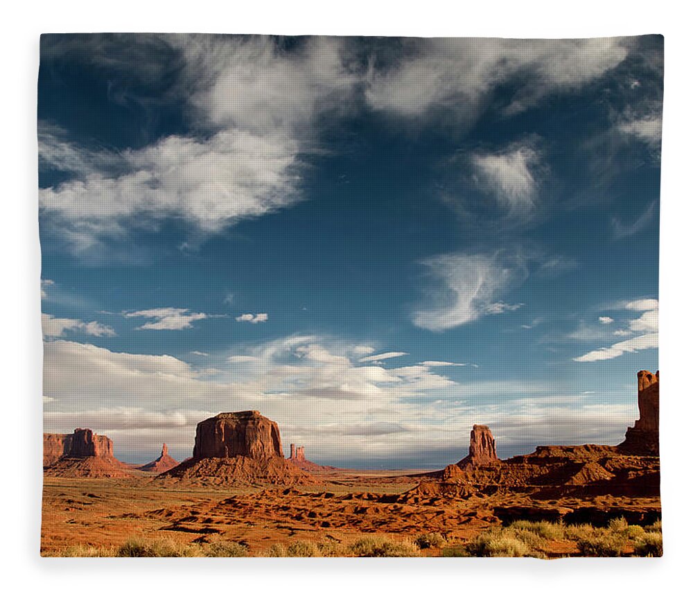 Scenics Fleece Blanket featuring the photograph Monument Valley With Dramatic Clouds #1 by Russell Burden