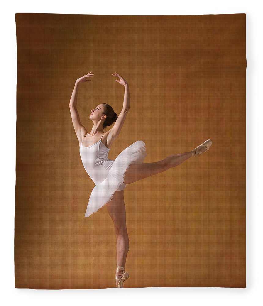 Expertise Fleece Blanket featuring the photograph Young Woman Performing Ballet Pose #1 by Pm Images