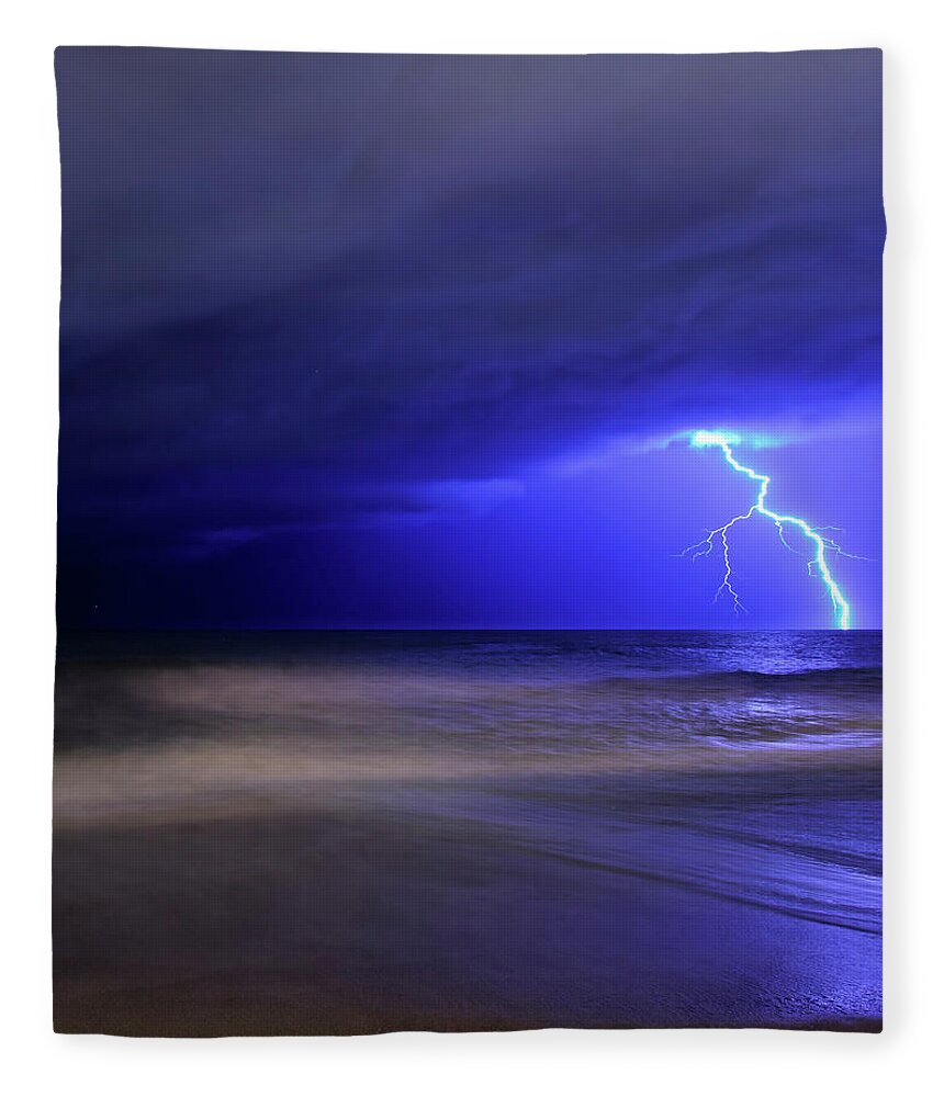 Water's Edge Fleece Blanket featuring the photograph A Bolt Of Lightning From An Approaching by Stocktrek Images/luis Argerich