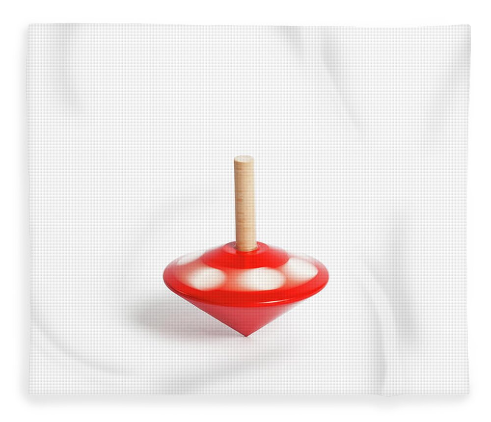 White Background Fleece Blanket featuring the photograph A Childs Spinning Wooden Top by Diane Macdonald
