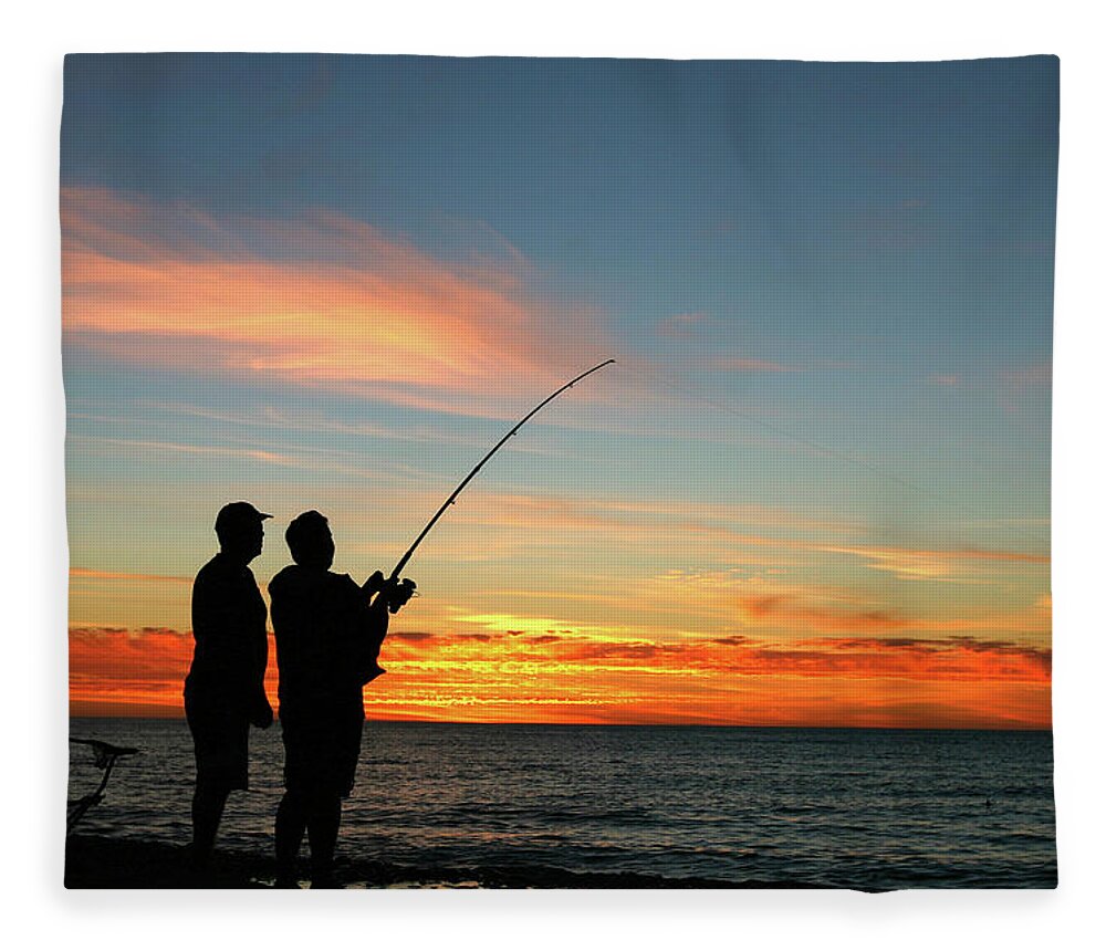 A Silhouette Of Two Men Fishing At Fleece Blanket by Jamesbowyer