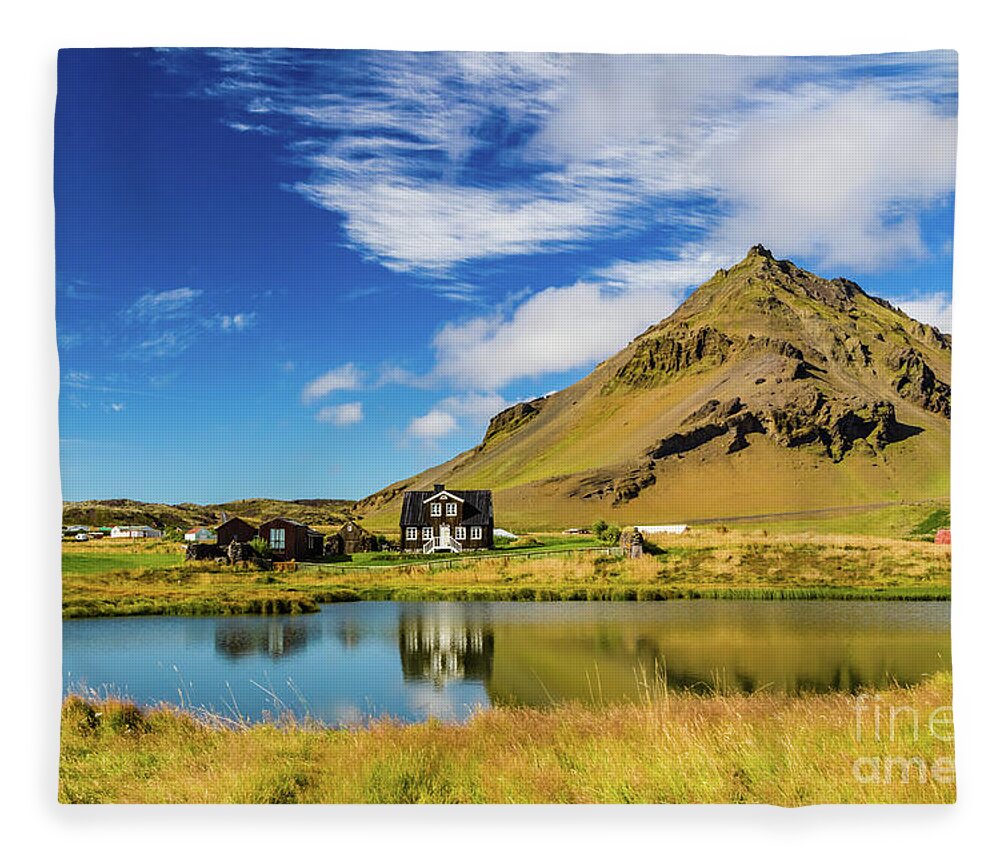 Arnarstapi Fleece Blanket featuring the photograph Arnarstapi Amtmansshus and Mount Stapafell, Iceland by Lyl Dil Creations