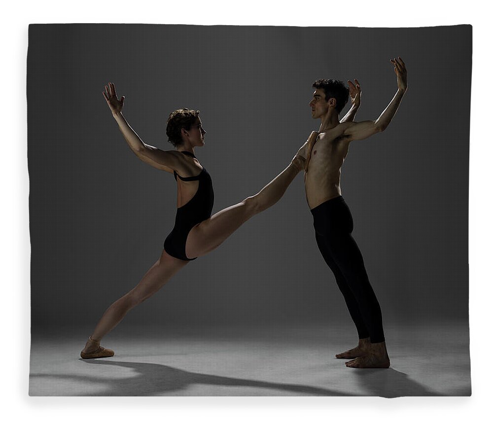 Tranquility Fleece Blanket featuring the photograph Ballet Dancers Performing A Pas De Deux by Nisian Hughes