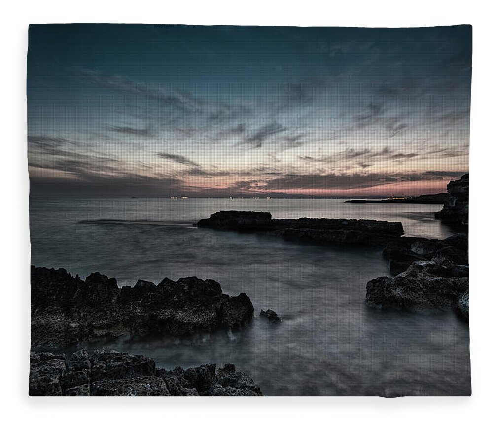 Seascape Fleece Blanket featuring the photograph Beautiful dramatic Sunset on a rocky coastline by Michalakis Ppalis