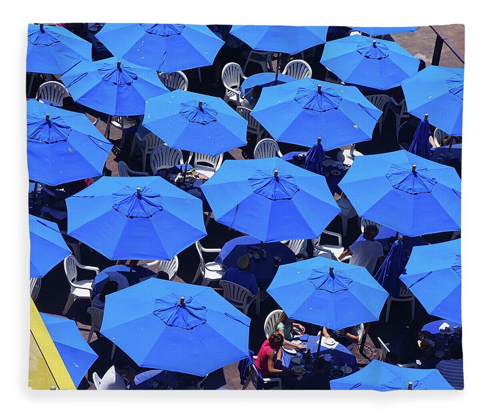 Seattle Fleece Blanket featuring the photograph Blue umbrellas of outdoor restaurant by Steve Estvanik
