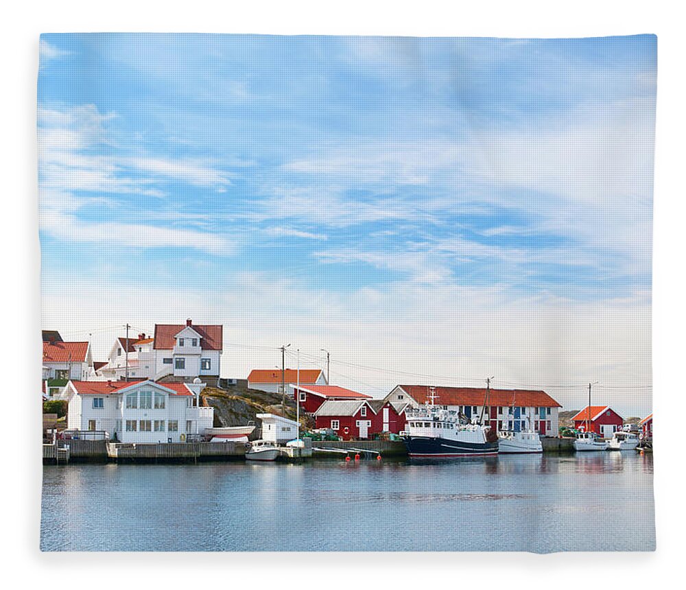 Water's Edge Fleece Blanket featuring the photograph Bohuslan Harbor Village by Martin Wahlborg