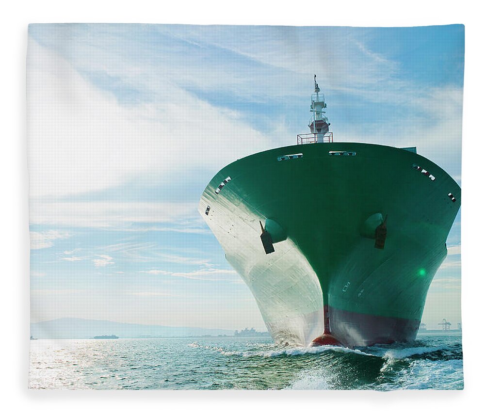 Trading Fleece Blanket featuring the photograph Bow View Of Cargo Ship Sailing On Ocean by Stewart Sutton