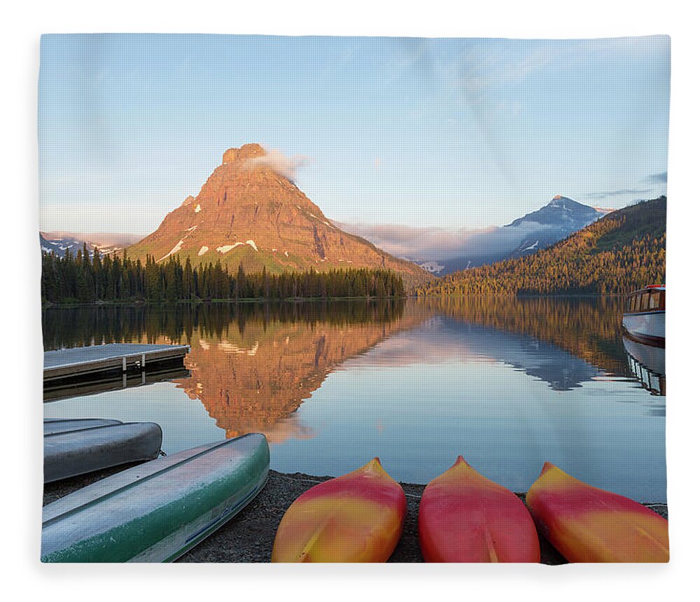 Tranquility Fleece Blanket featuring the photograph Canoes At Two Medicine Lake by Peter Adams