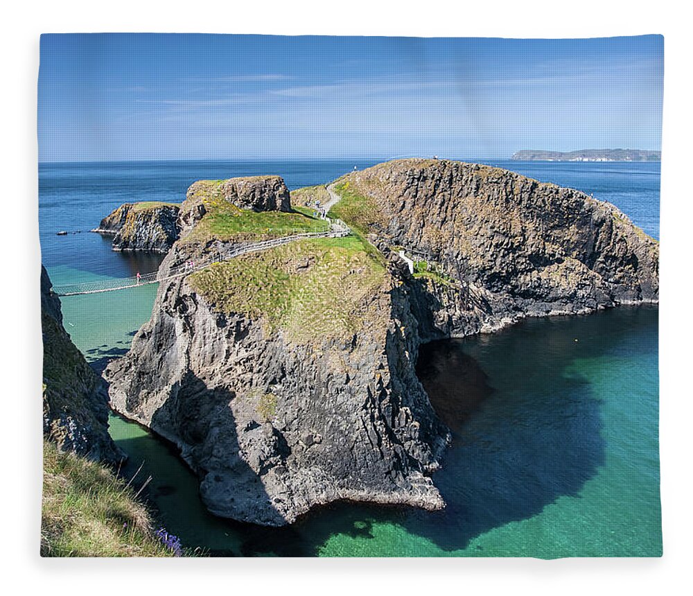Tranquility Fleece Blanket featuring the photograph Carrick-a-rede Rope Bridge In Northern by Pierre Leclerc Photography