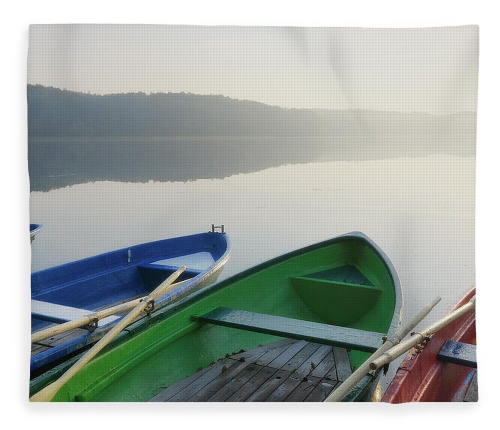 Tranquility Fleece Blanket featuring the photograph Colored Boats In Morning Light by Cornelia Doerr