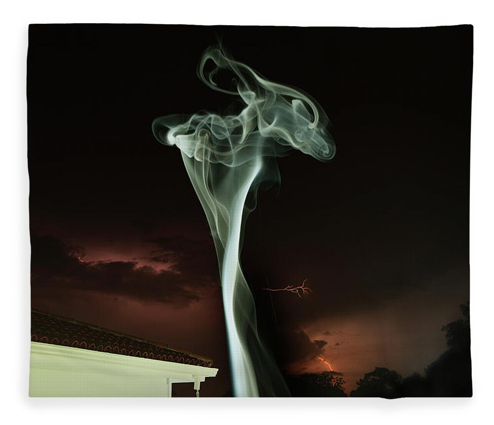 Spooky Fleece Blanket featuring the photograph Column Of Smoke Next To Building by Paul Taylor