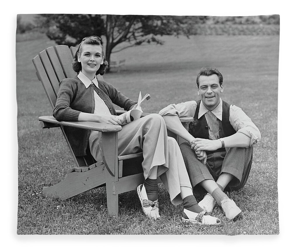 Heterosexual Couple Fleece Blanket featuring the photograph Couple Sitting Outdoors by George Marks