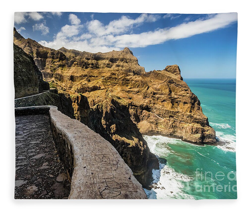 Cliff Fleece Blanket featuring the photograph Scenic route to Fontainhas, Santo Antao, Cape Verde by Lyl Dil Creations