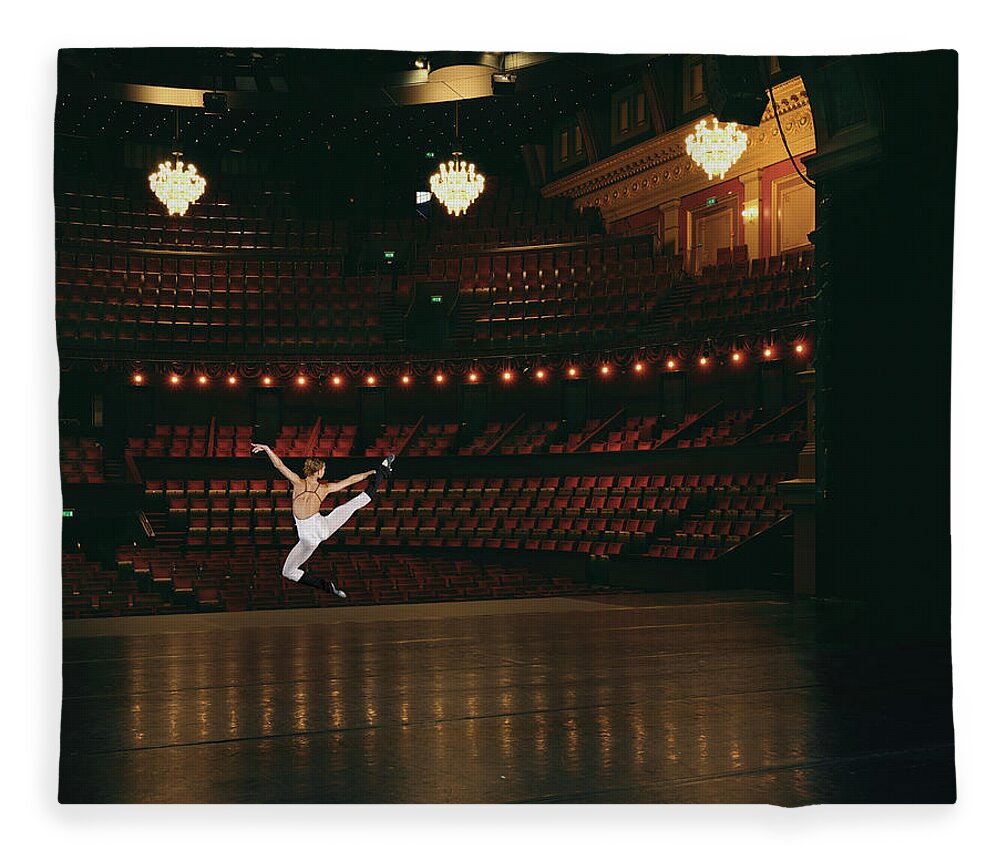 Ballet Dancer Fleece Blanket featuring the photograph Female Ballet Dancer Jumping Onstage by Matt Henry Gunther