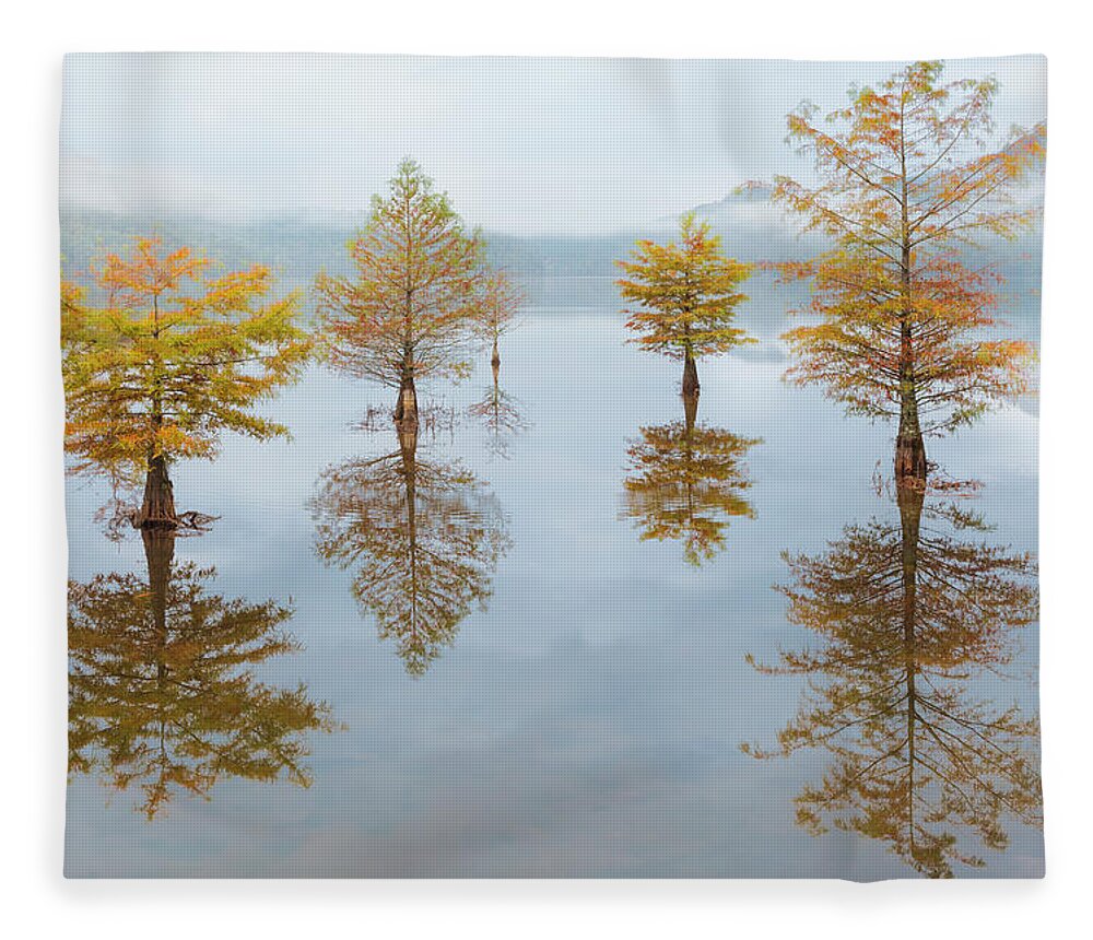 Carolina Fleece Blanket featuring the photograph Floating Into Fall by Debra and Dave Vanderlaan