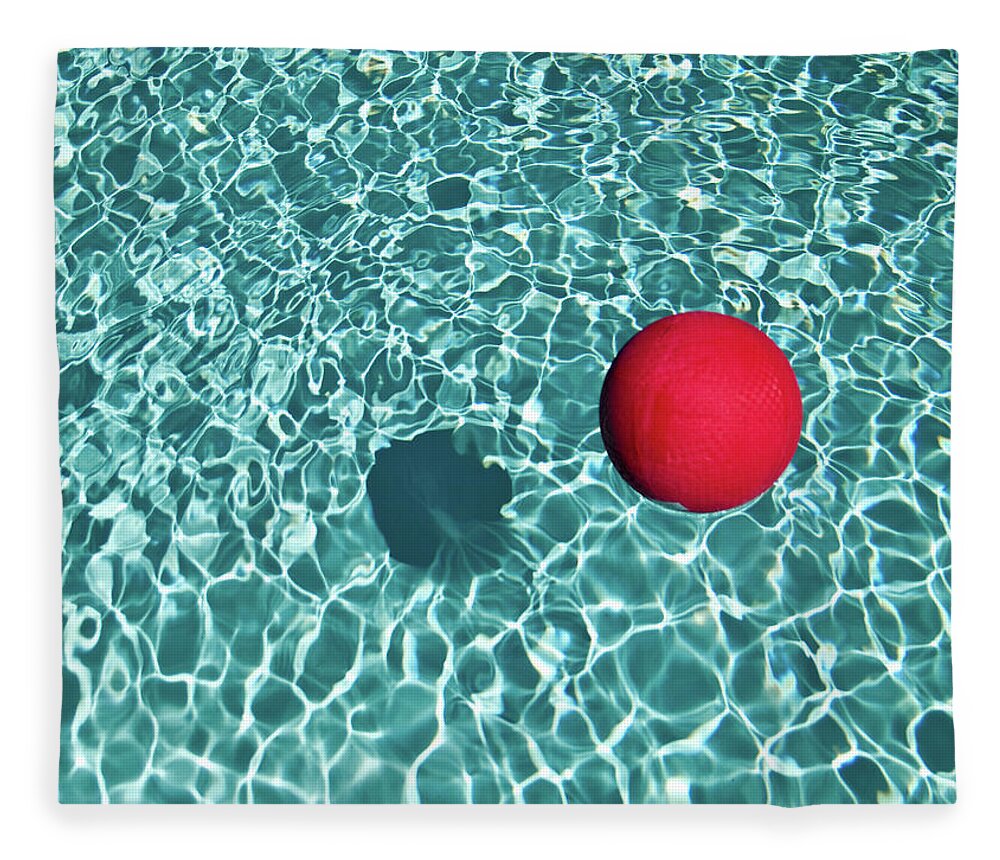 Tranquility Fleece Blanket featuring the photograph Floating Red Ball In Blue Rippled Water by Mark A Paulda