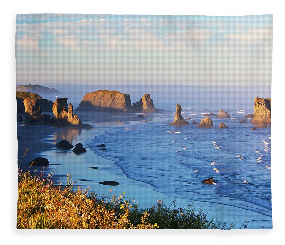 Water's Edge Fleece Blanket featuring the photograph Fog Covers Rock Formations Along The by Craig Tuttle / Design Pics