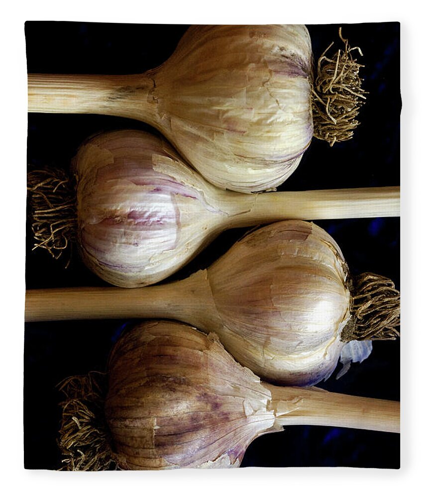 In A Row Fleece Blanket featuring the photograph Four Garlic Heads With Stems And Roots by Rebecca E Marvil