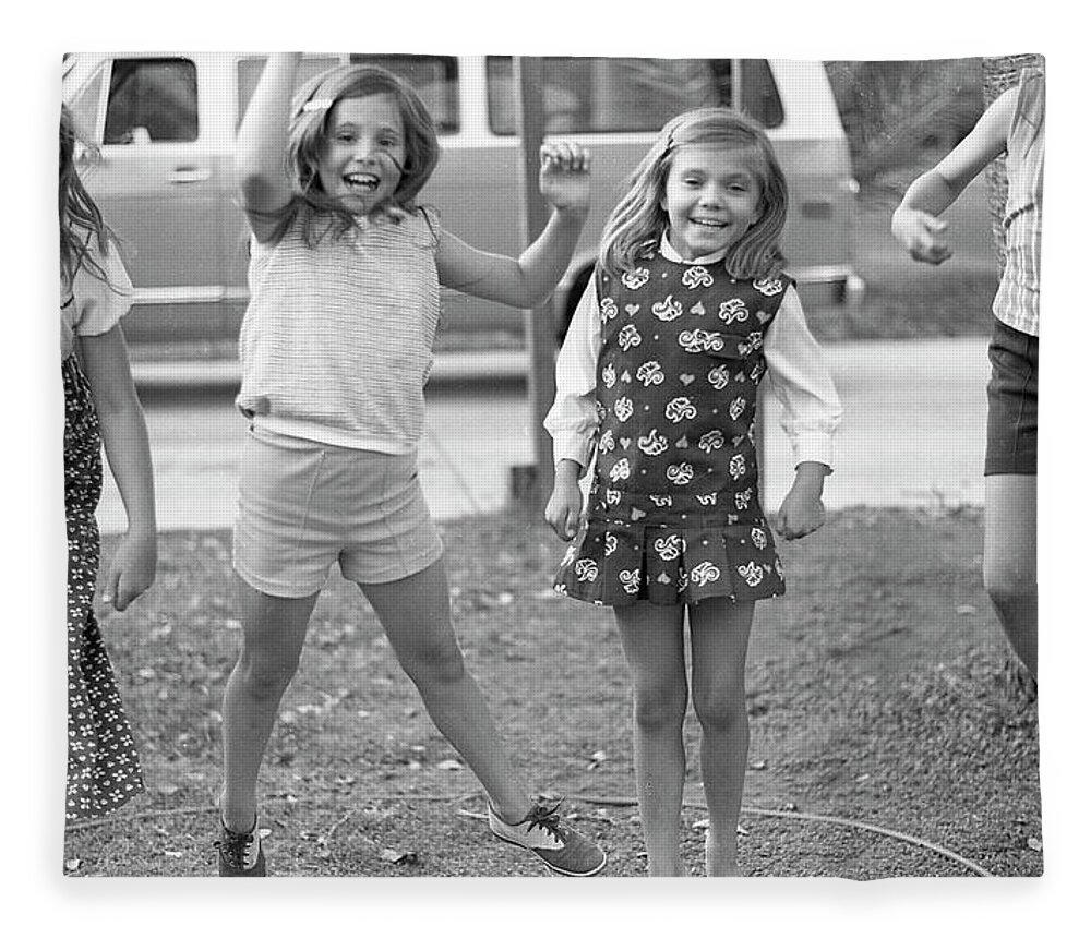 Jumping Fleece Blanket featuring the photograph Four Girls, Jumping, 1972 by Jeremy Butler