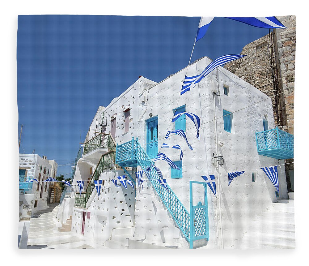 Greek Culture Fleece Blanket featuring the photograph Greek Pennant Flags Waving In Breeze On by Abzee