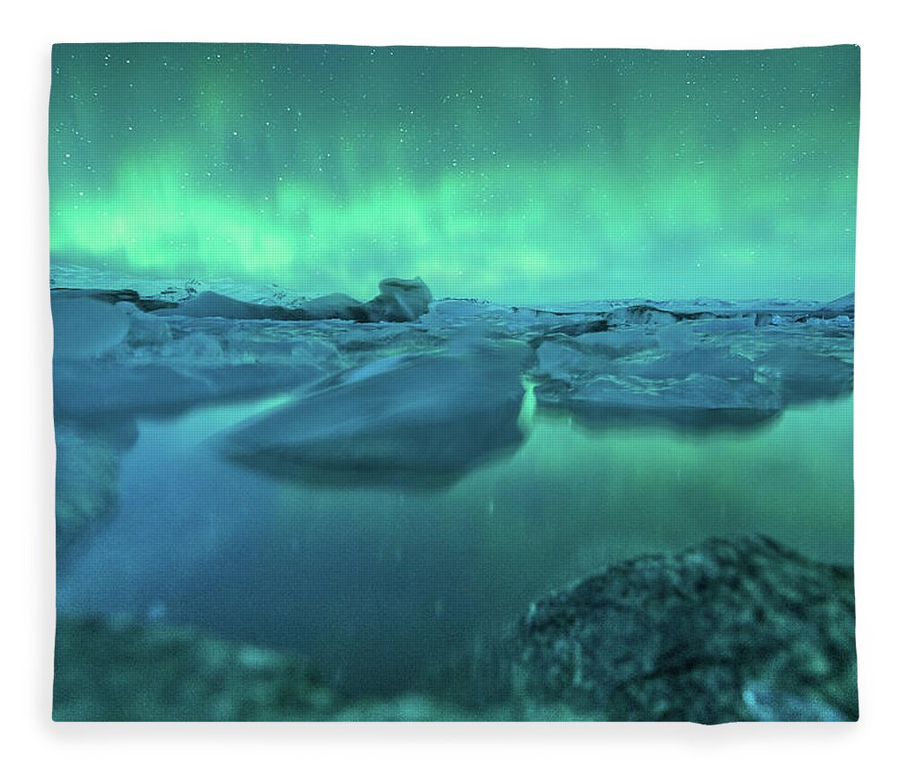 Scenics Fleece Blanket featuring the photograph Jokusarlon Glacial Lake With Aurora by Coolbiere Photograph