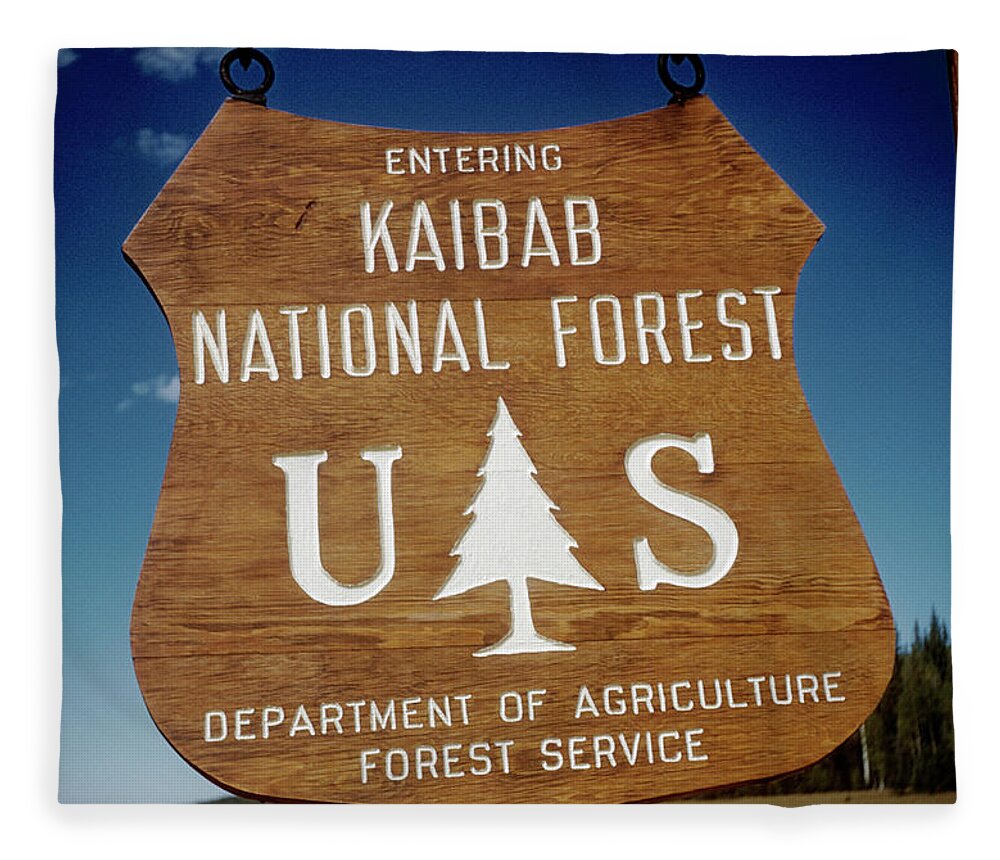https://render.fineartamerica.com/images/rendered/default/flat/blanket/images/artworkimages/medium/2/kaibab-national-forest-sign-grand-canyon-national-park-arizona-gran100-00311-kevin-russell.jpg?&targetx=-101&targety=0&imagewidth=1155&imageheight=800&modelwidth=952&modelheight=800&backgroundcolor=224874&orientation=1&producttype=blanket-coral-50-60