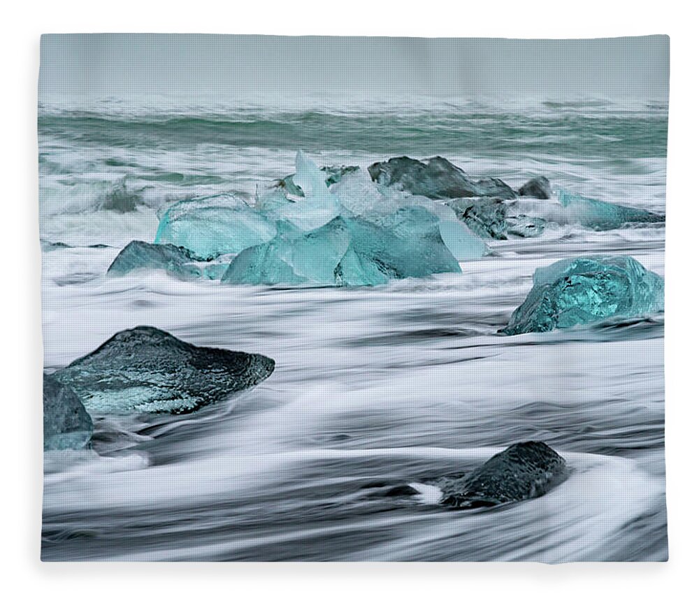 Iceland Fleece Blanket featuring the photograph Long exposure at the Jokulsarlon ice beach by Mark Hunter
