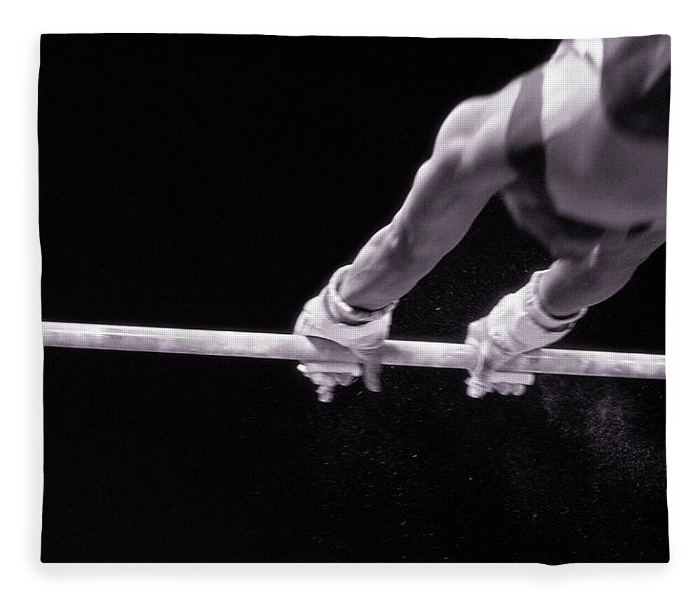 One Man Only Fleece Blanket featuring the photograph Male Gymnast Grasping Parallel Bar by David Madison