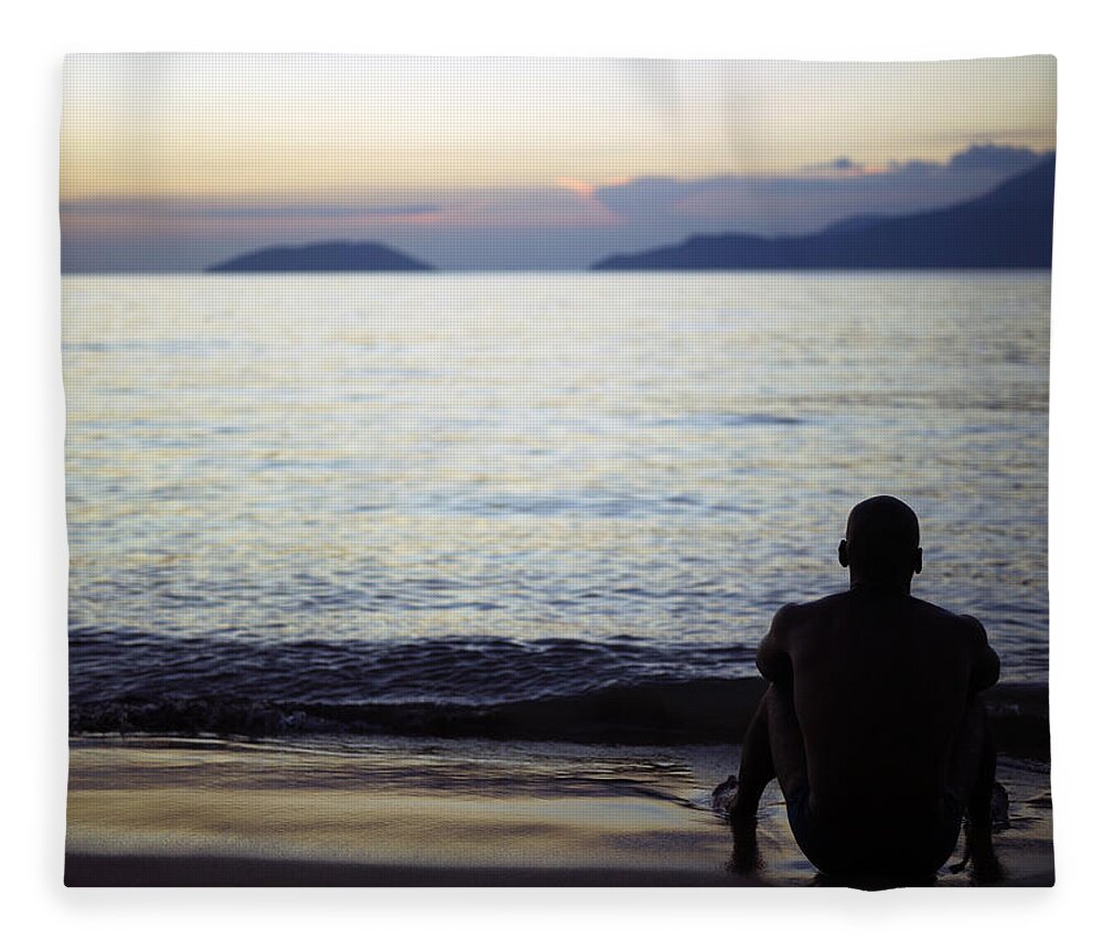 Young Men Fleece Blanket featuring the photograph Man Sitting Alone On A Beach by Win-initiative/neleman