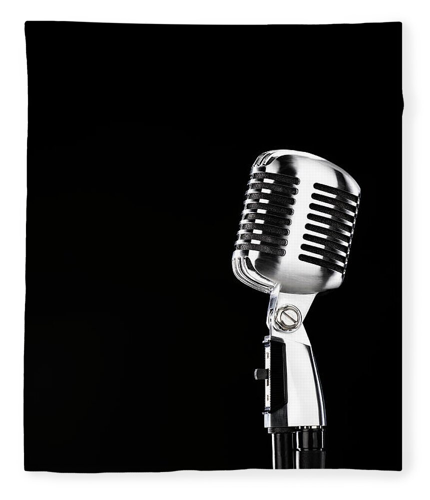 Music Fleece Blanket featuring the photograph Microphone Against Black Background by Peter Dazeley