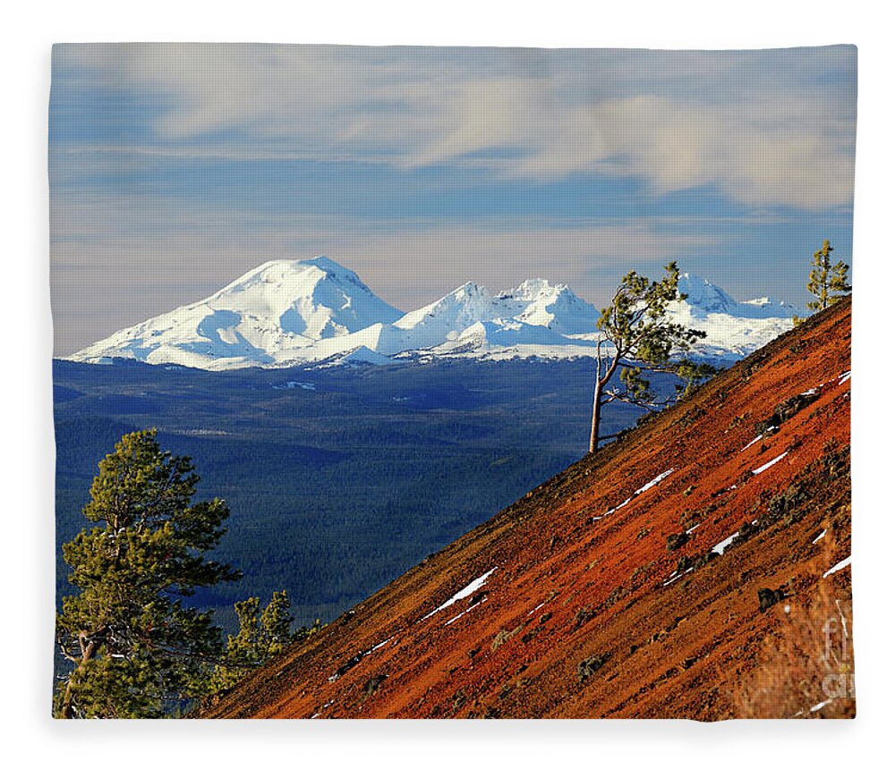 Summer Fleece Blanket featuring the photograph Mokst Butte red cinder cone and distant snowy Cascade Mountains Mts and 3 Three Sisters Wilderness by Robert C Paulson Jr