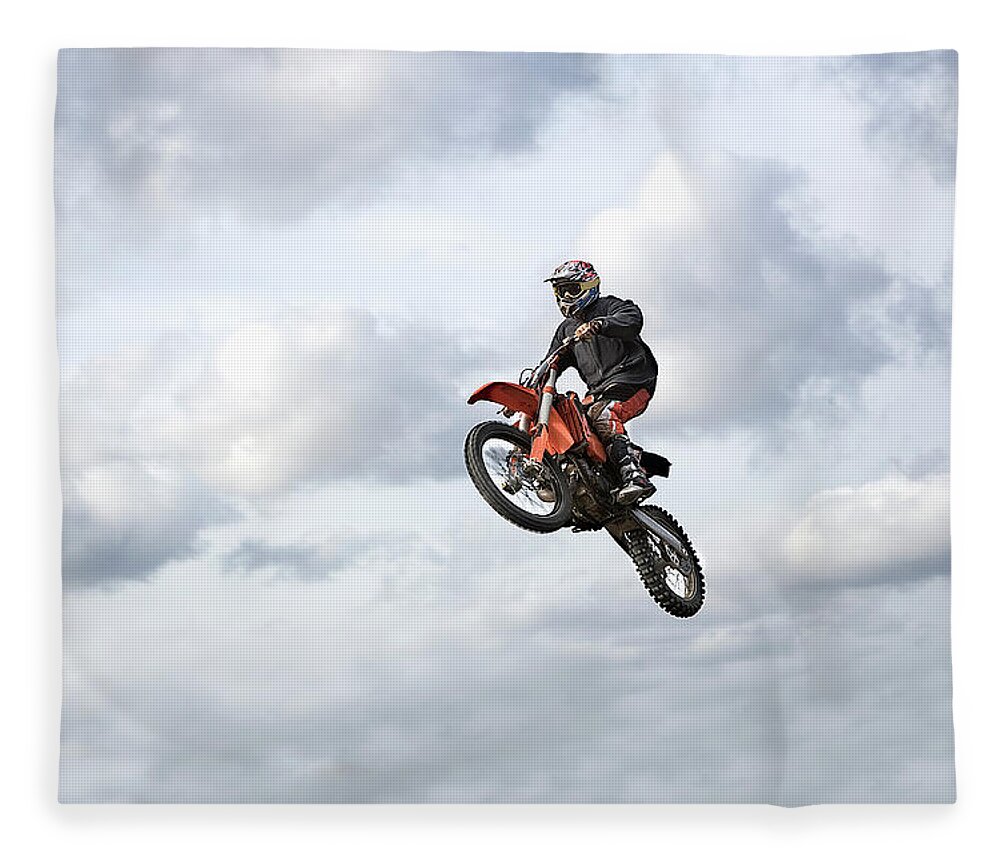 Recreational Pursuit Fleece Blanket featuring the photograph Motocross Rider In Mid-air, Low Angle by Claus Christensen