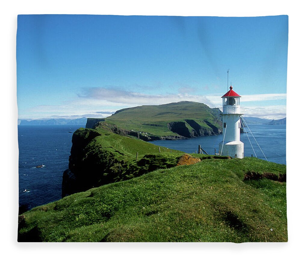 Tranquility Fleece Blanket featuring the photograph Mykines Lighthouse by Michele D'amico Supersky77