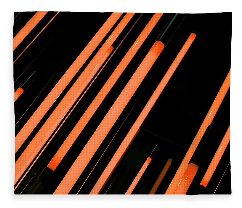 Shadow Fleece Blanket featuring the photograph Neon Orange Rods Of Glowing Light by Ralf Hiemisch