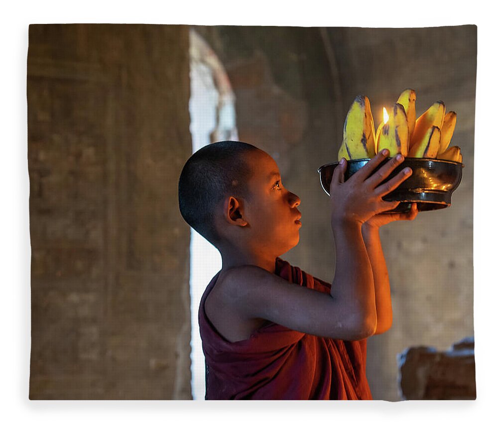 Boy Fleece Blanket featuring the photograph Novice Monk Making An Offering by Ann Moore