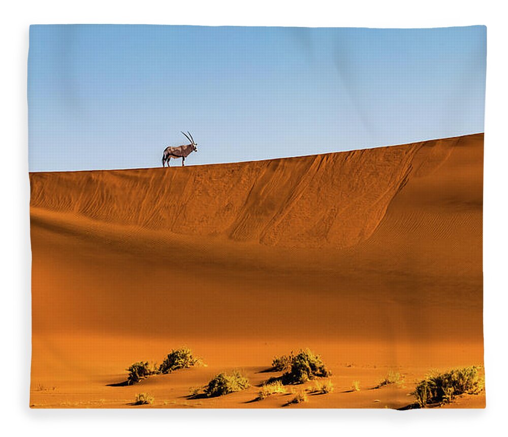 Gemsbok Fleece Blanket featuring the photograph Oryx on the dune, Namibia by Lyl Dil Creations