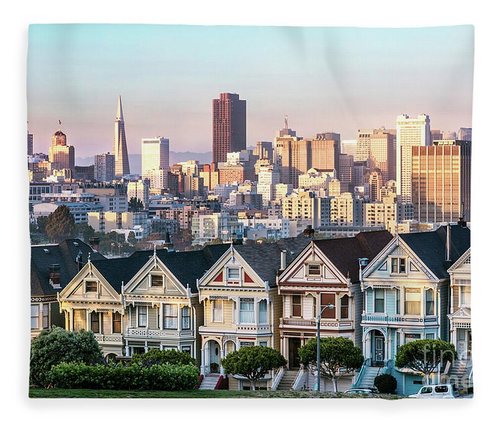 San Francisco Skyline Fleece Blanket featuring the photograph Painted ladies and skyline at sunset, San Francisco, California, by Matteo Colombo
