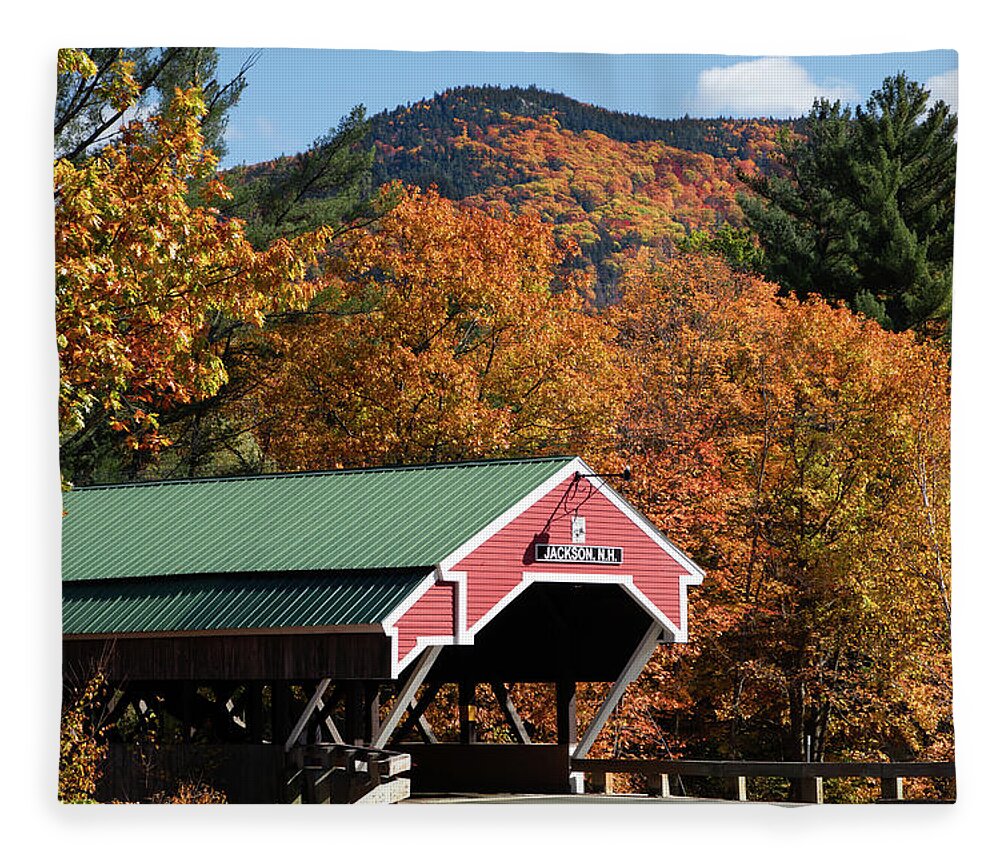 Jackson Nh Fleece Blanket featuring the photograph Peak fall colors over the Jackson Covered Bridge by Jeff Folger