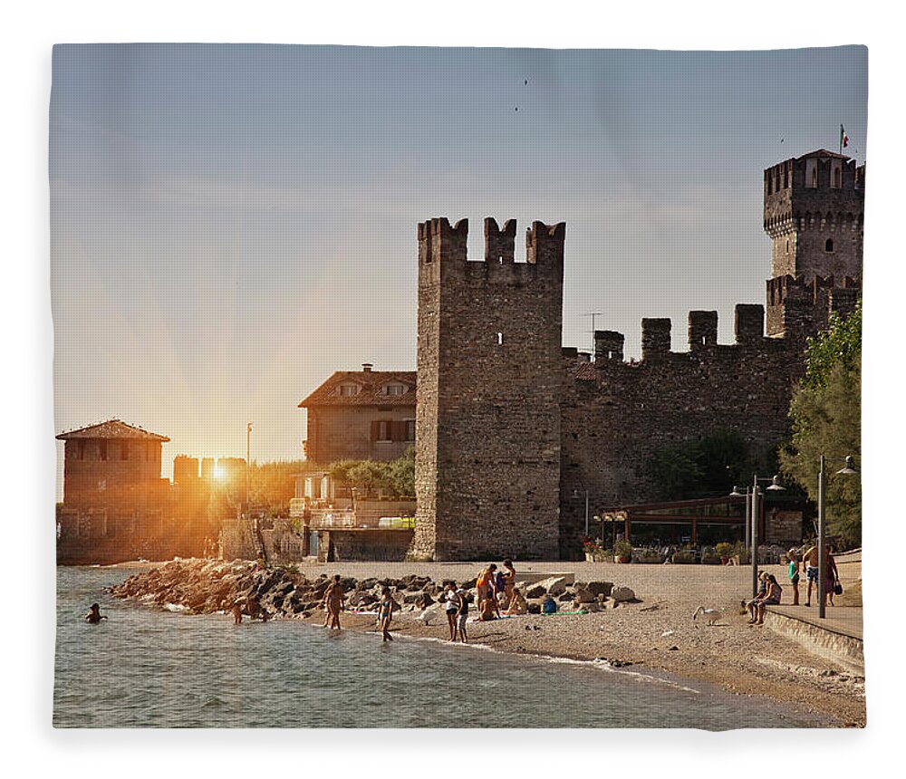 People Fleece Blanket featuring the photograph People On Beach Near Castle by Cultura Rm Exclusive/walter Zerla