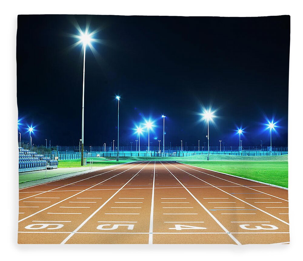 Performance Fleece Blanket featuring the photograph Race Track At Night by Mike Harrington